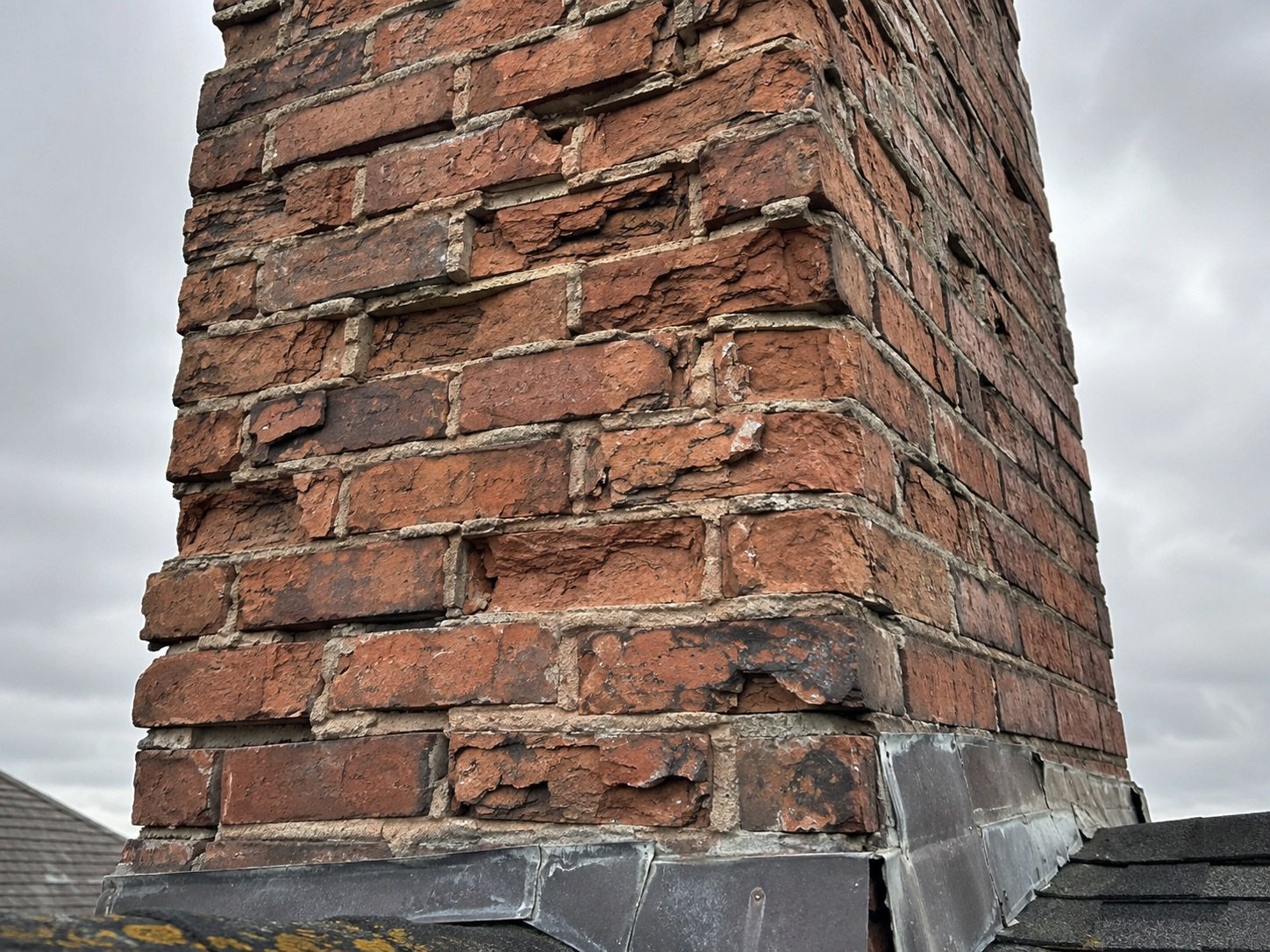 Fixing brick chimney with spalled brick and eroded mortar joints